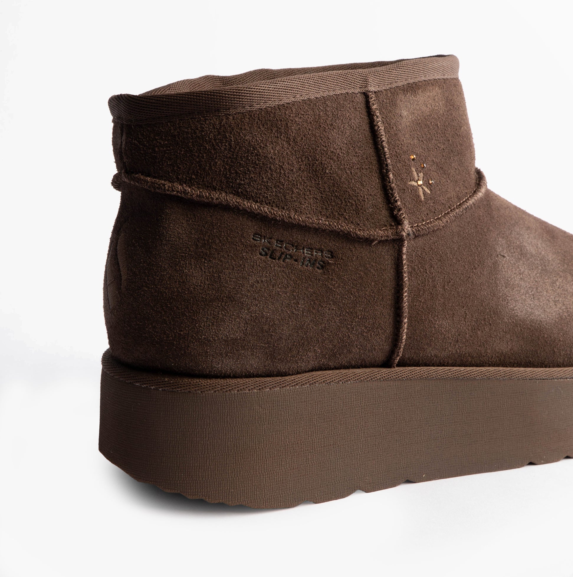 Skechers 169143/CHOC KEEP COZY Womens Boots Chocolate side view featuring faux leather upper and rubber sole.