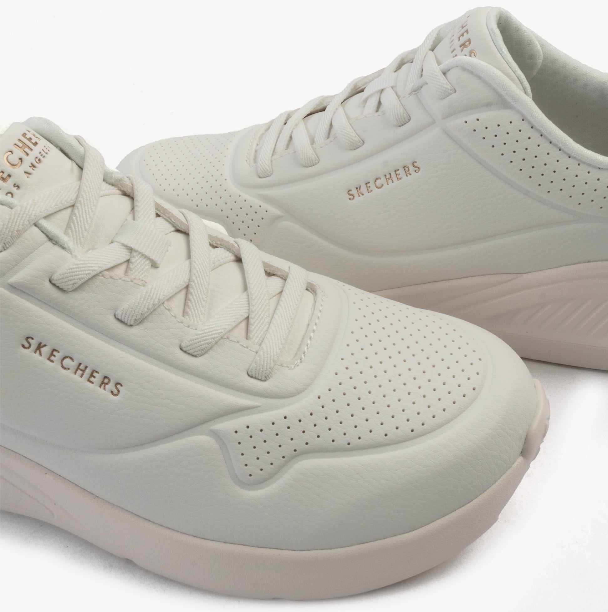 Side view of Skechers 177289/WHT UNO LITE - LITE WORK Womens Trainers White, showcasing the synthetic leather upper and lace-up design.