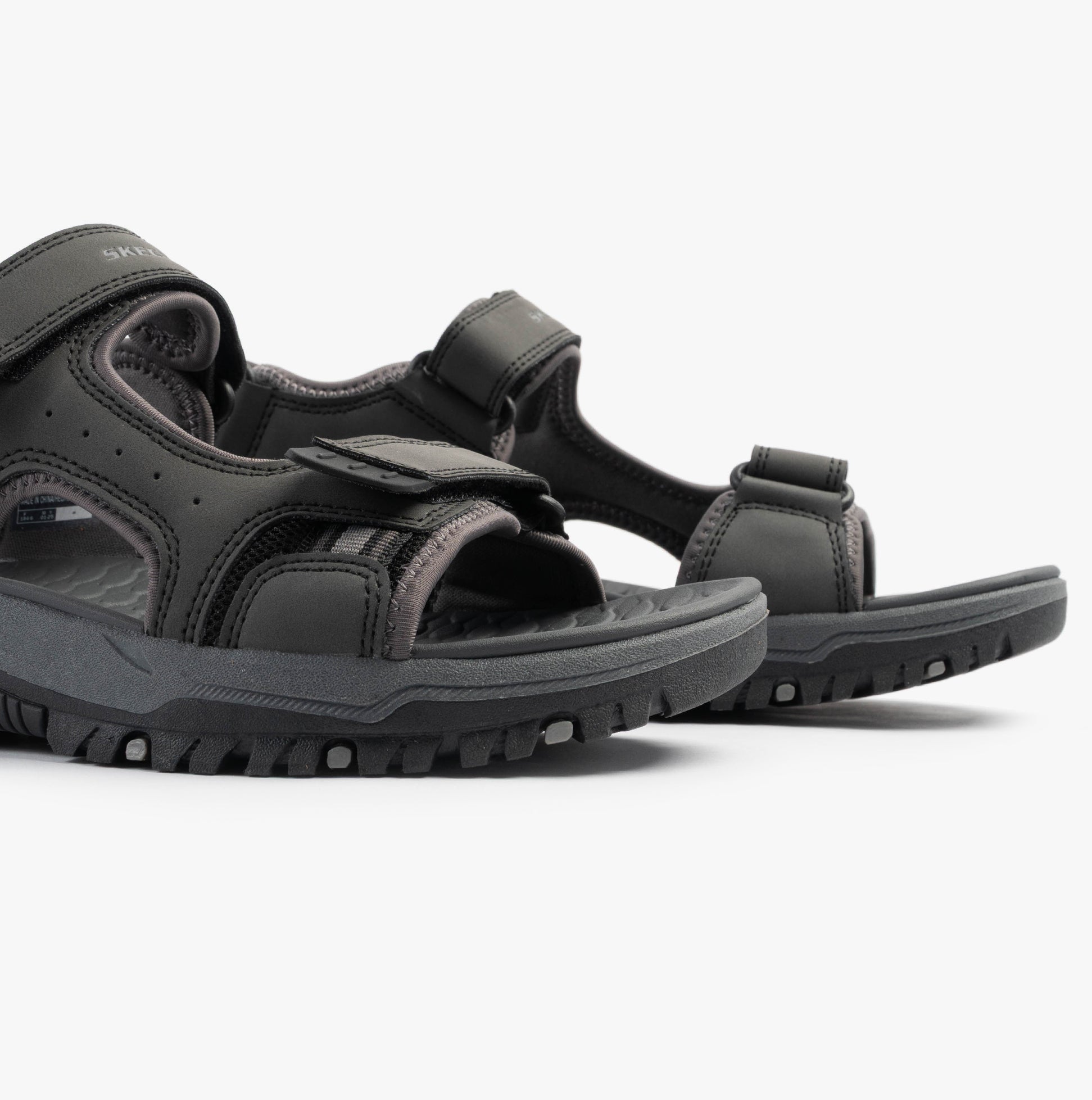 Skechers 205139/BLK PREWITT - RIGDON Mens Sandals Black side view showcasing synthetic upper and rubber sole.