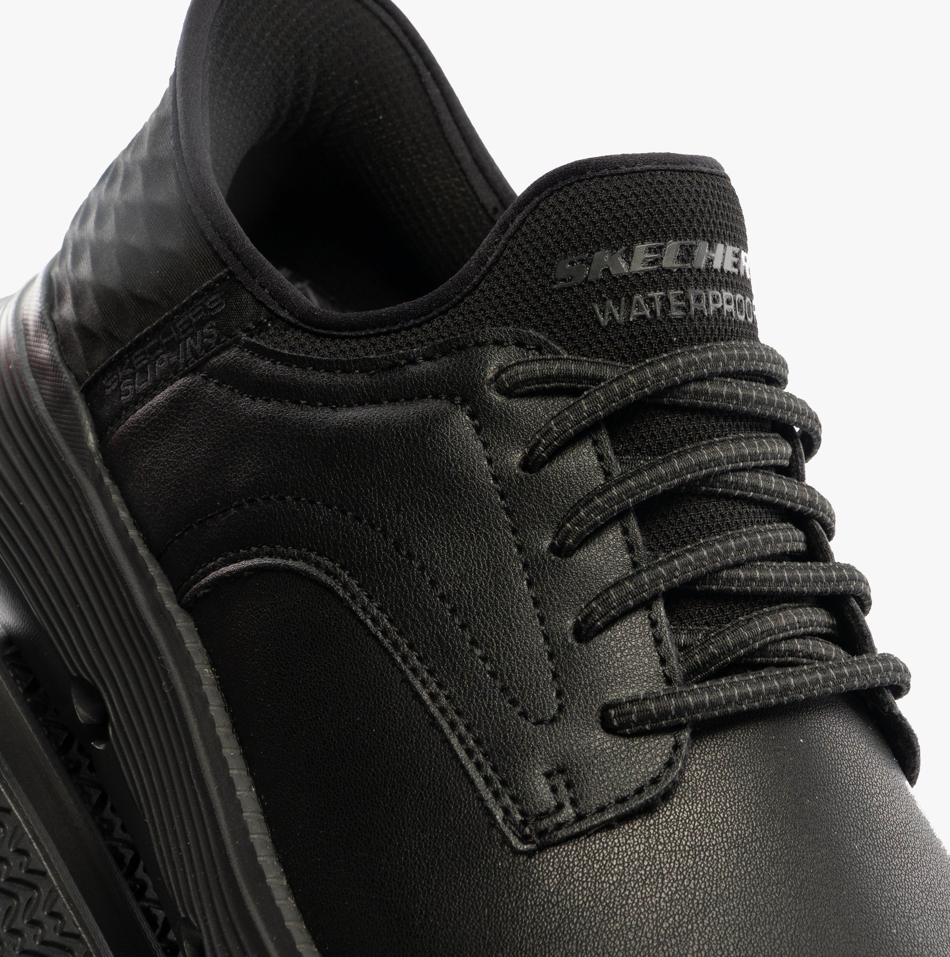 Skechers 205278/BBK GARZA - CARLYN Mens Shoes Black close-up view showing laces and synthetic upper.