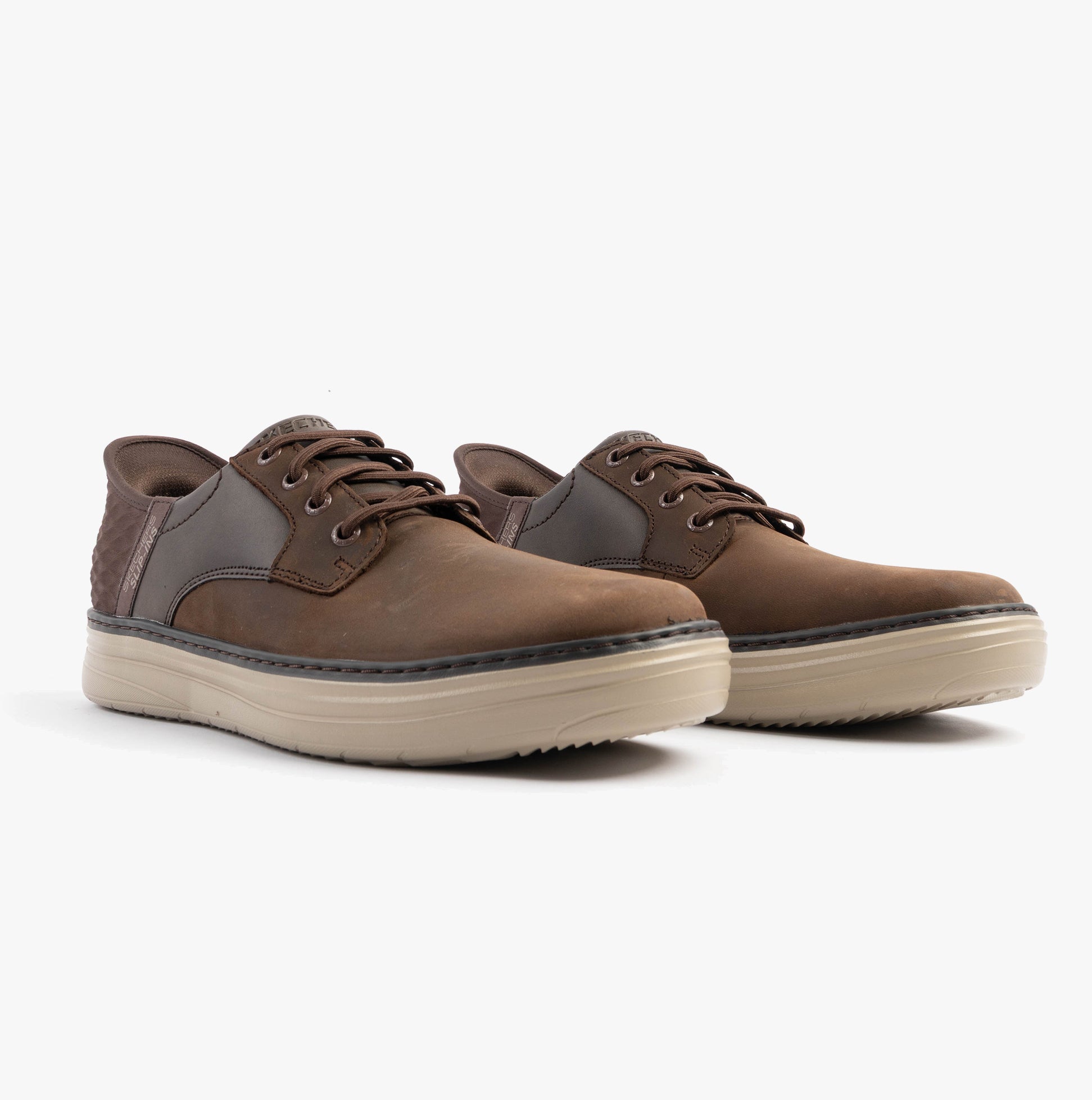 Skechers 205279/COC HYLAND - RADLEY Mens Trainers Cocoa side view showcasing brown leather upper and relaxed fit.