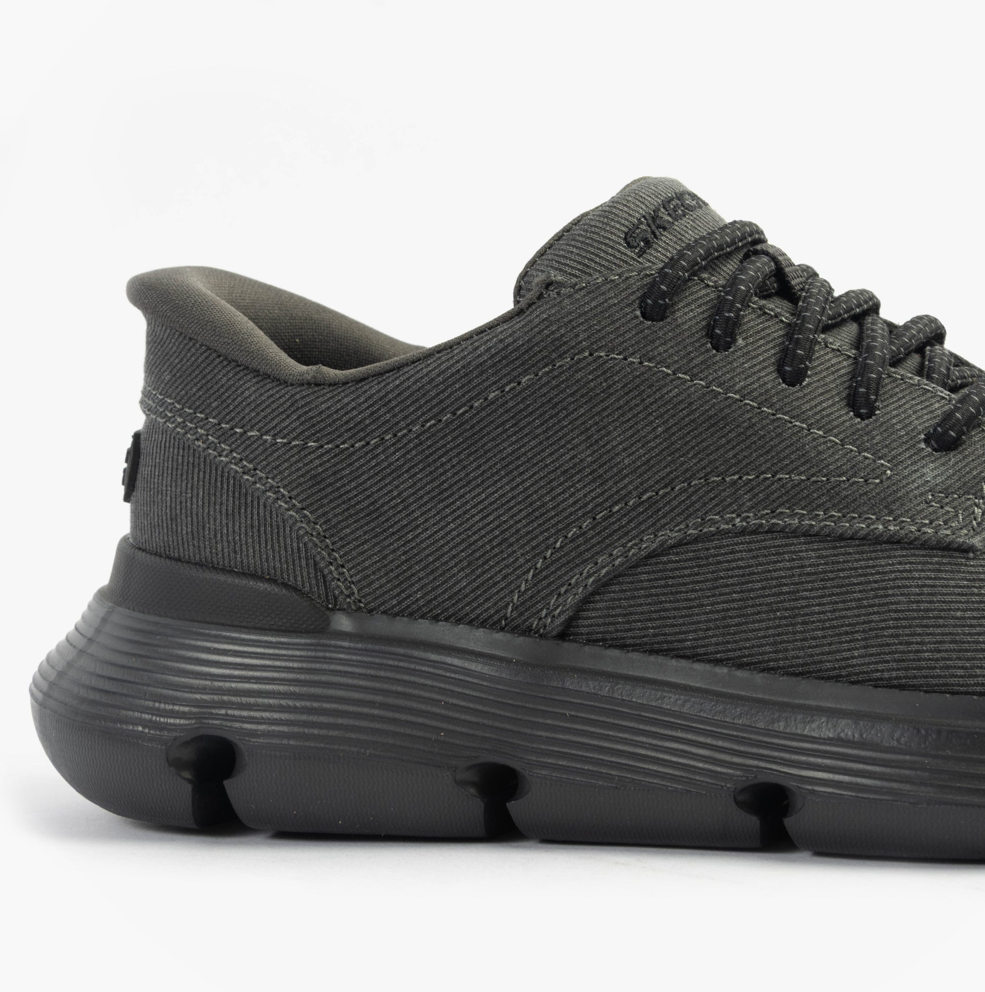 Skechers 205352/BLK GARZA - CLIVE Mens Shoes Black side view showcasing canvas upper and relaxed fit.