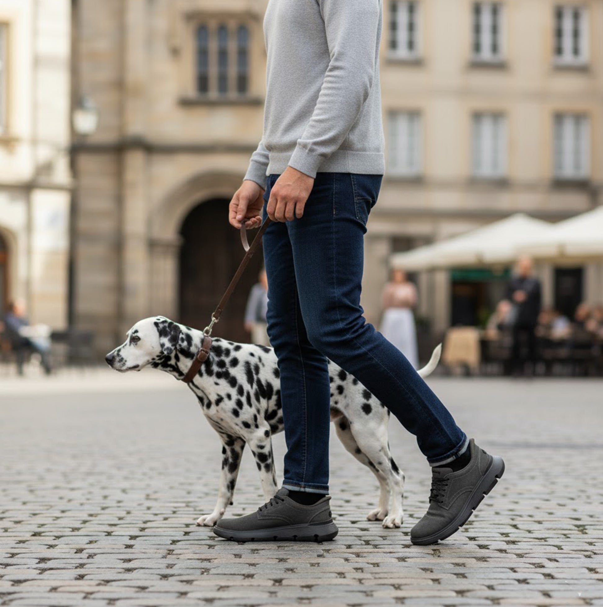 Skechers 205352/BLK GARZA - CLIVE Mens Shoes Black side view on a man walking a dog in a cobblestone street.