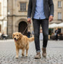 Skechers 205352/DKTP GARZA - CLIVE Mens Shoes Dark Taupe side view worn while walking a dog.
