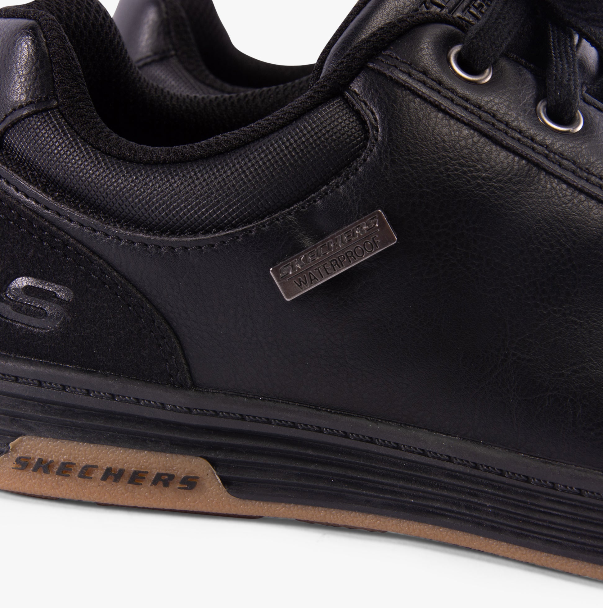Skechers 210944/BLK CAVELL - SPARKMAN Mens Trainers Black close-up view highlighting waterproof label and faux leather upper.