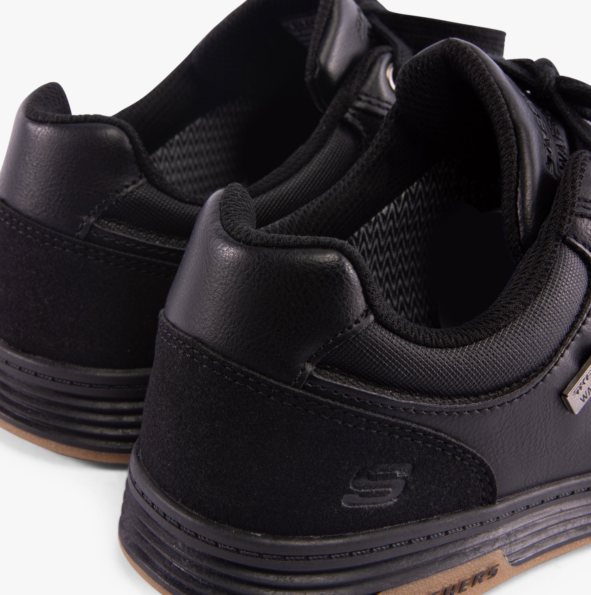 Skechers 210944/BLK CAVELL - SPARKMAN Mens Trainers Black close-up side view showcasing the faux leather upper and lace-up design.