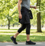 Skechers 216333/BBK GO WALK FLEX - OJAI Mens Trainers Black side view worn during outdoor walk in park.