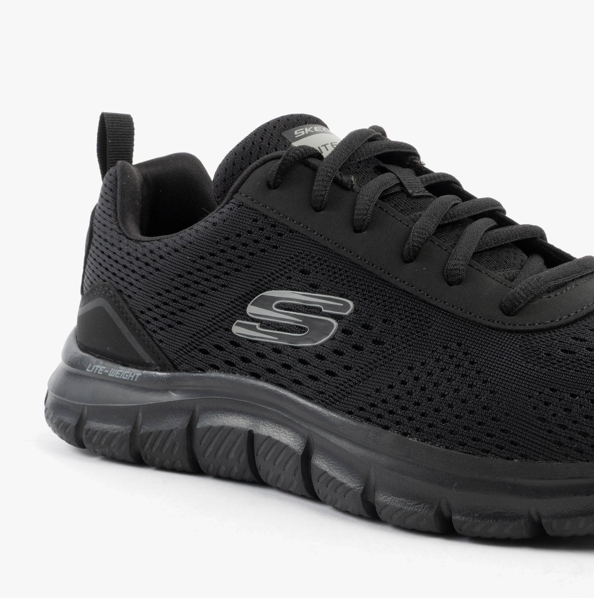 Skechers 232758/BBK TRACK - LESHUR Mens Trainers Black side view featuring synthetic mesh upper and rubber sole.