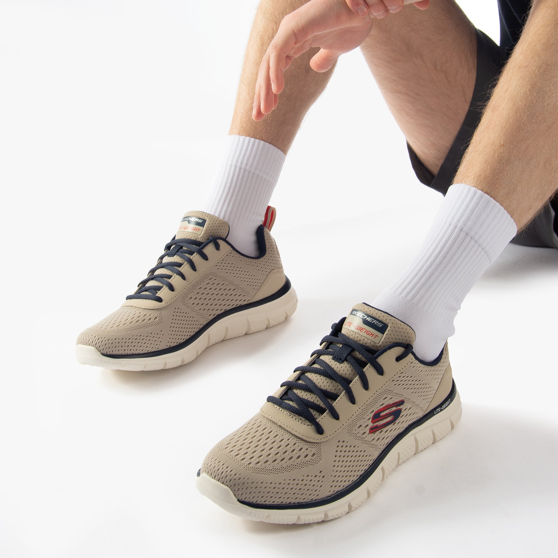 Skechers 232758/TPNV TRACK - LESHUR Mens Trainers Taupe/Navy, side view, showcasing lightweight mesh upper and lace-up design.