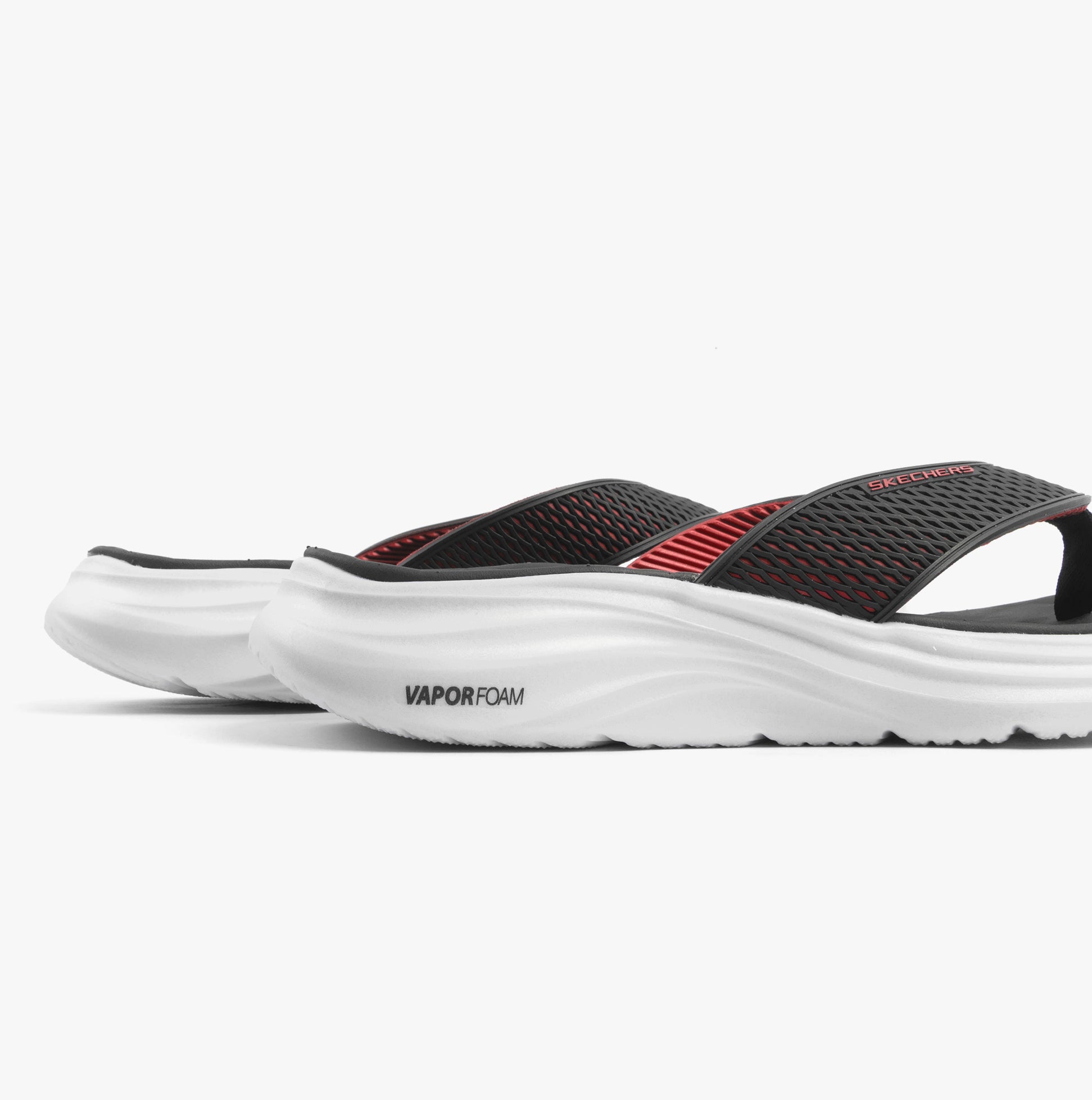 Skechers 232894/BKRD VAPOR FOAM SANDAL - SAYTO Mens Sandals Black/Red side view showcasing the slip-on design and VaporFoam sole.