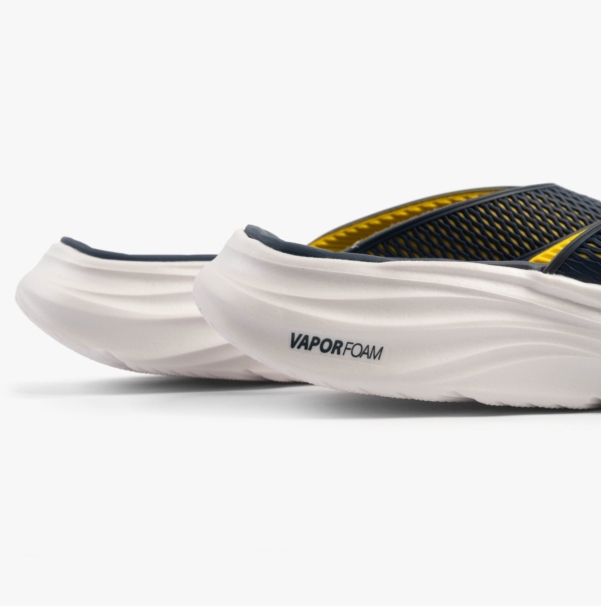 Skechers 232894/NVYL VAPOR FOAM SANDAL - SAYTO Mens Sandals Navy/Yellow side view showcasing foam cushioning.