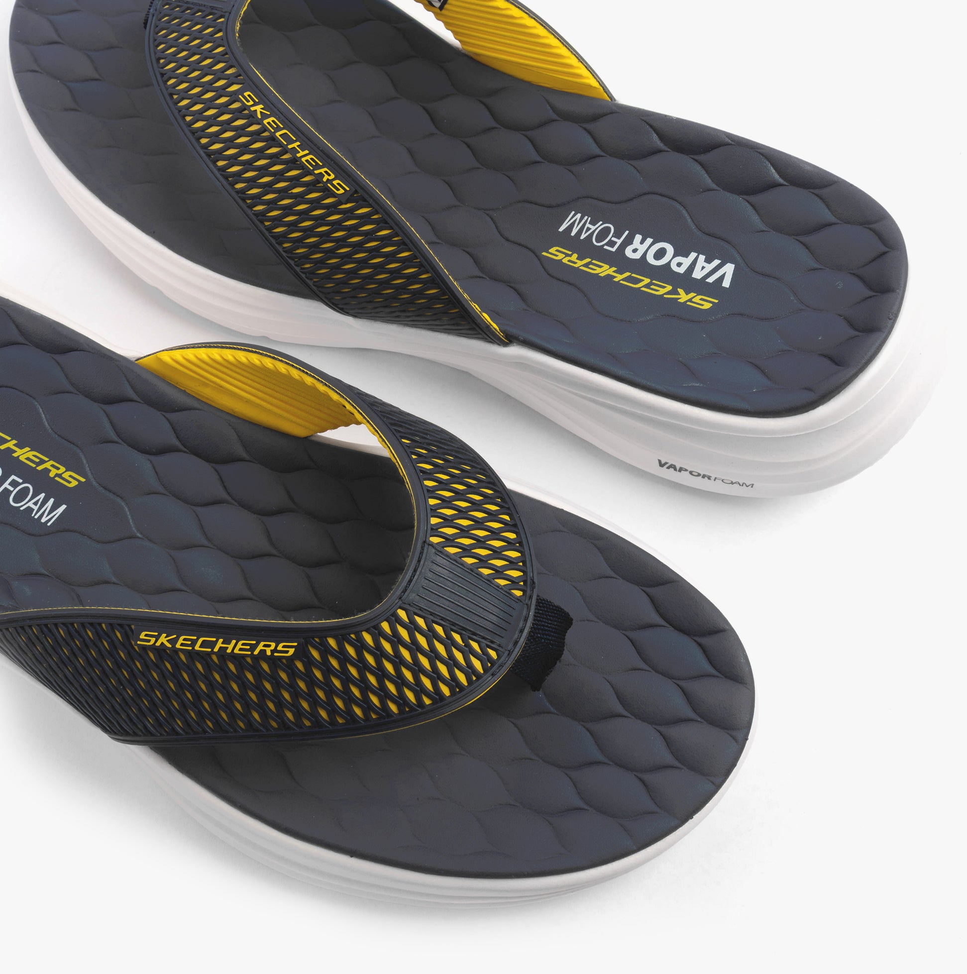Skechers 232894/NVYL VAPOR FOAM SANDAL - SAYTO Mens Sandals Navy/Yellow detail view of sandal footbed and straps.