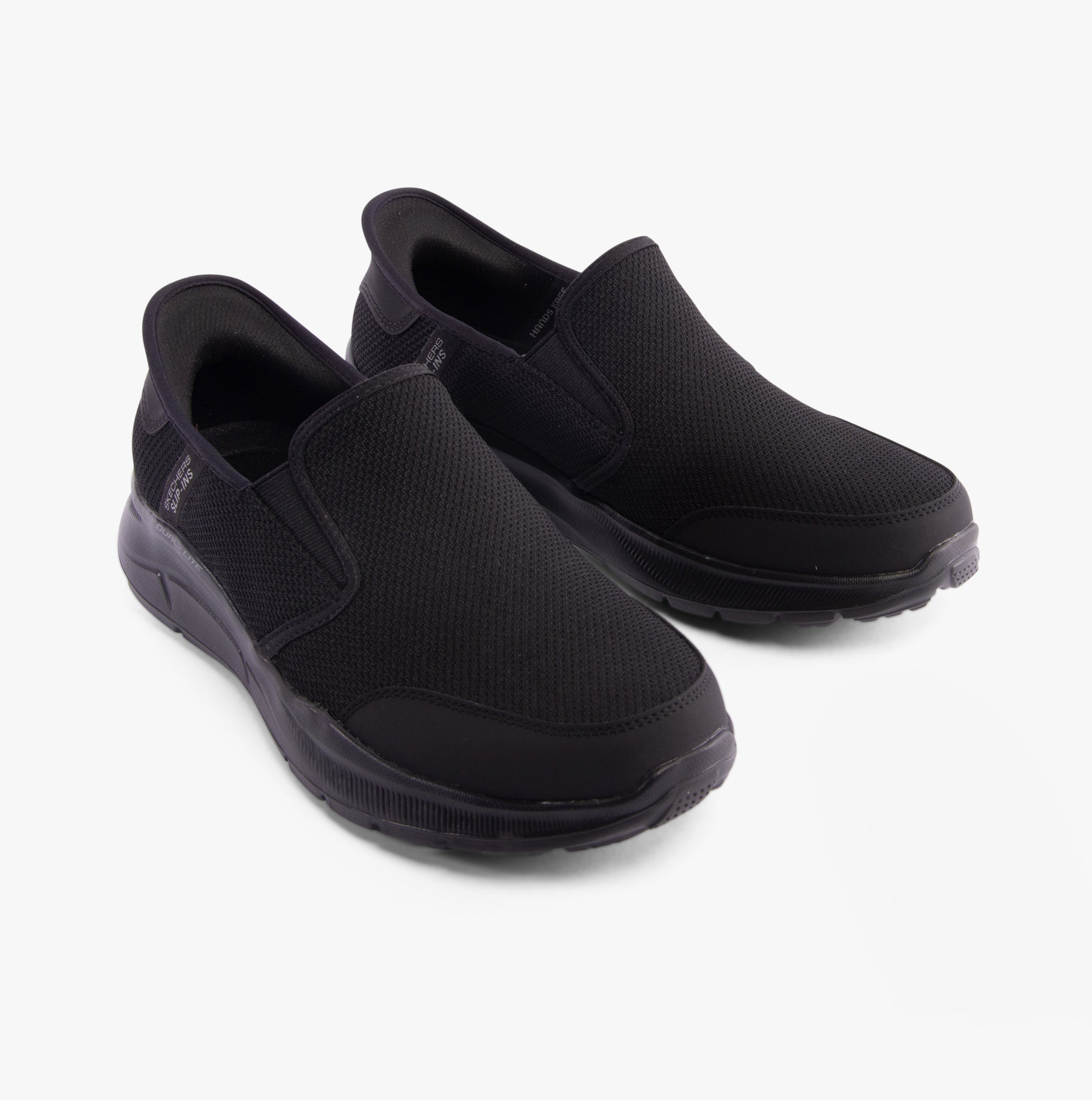 Skechers 232926/BBK EQUALIZER 5.0 - DRAYZE Mens Trainers Black side view with breathable mesh upper and slip-on design.