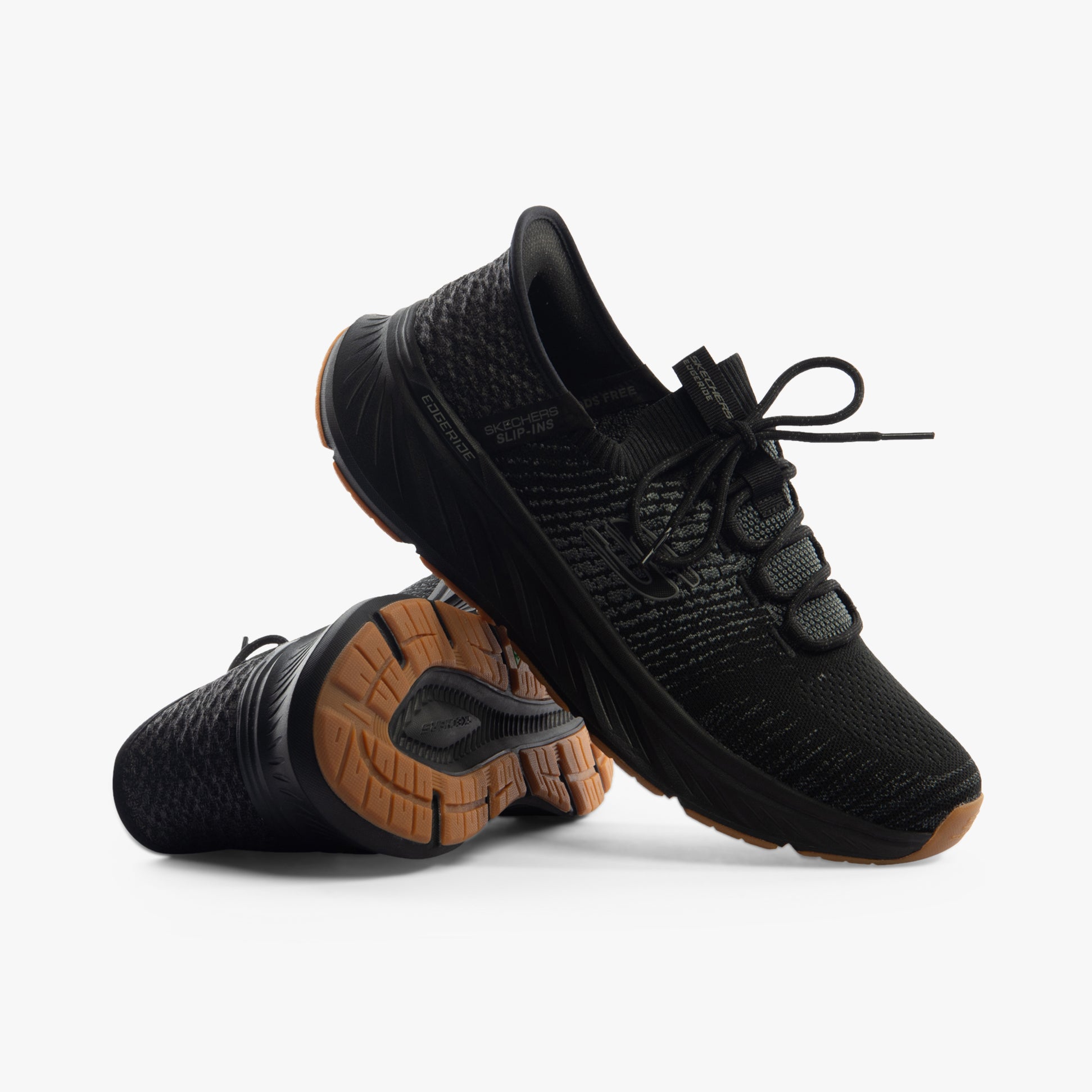 Skechers 232932/BBK EDGERIDE - RAYGO Mens Trainers Black side view with textured upper and rubber sole.