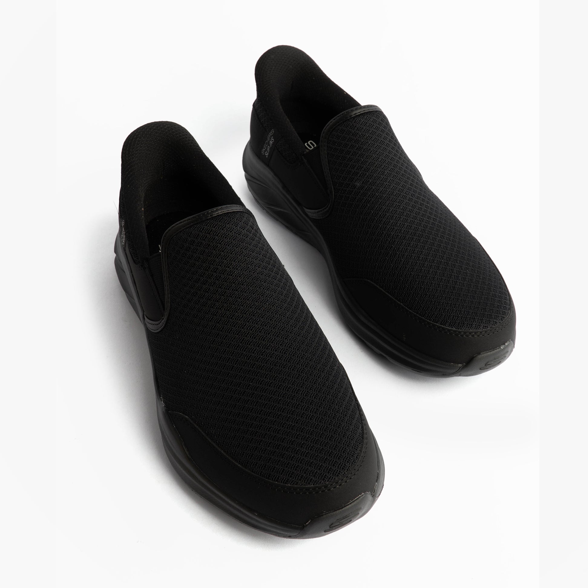 Skechers 233103/BBK EQUALIZER 6.0 - STOAVER Mens Trainers Black top view showing slip-on design and mesh upper.