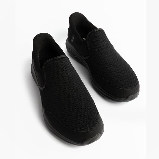 Skechers 233103/BBK EQUALIZER 6.0 - STOAVER Mens Trainers Black top view showing slip-on design and mesh upper.