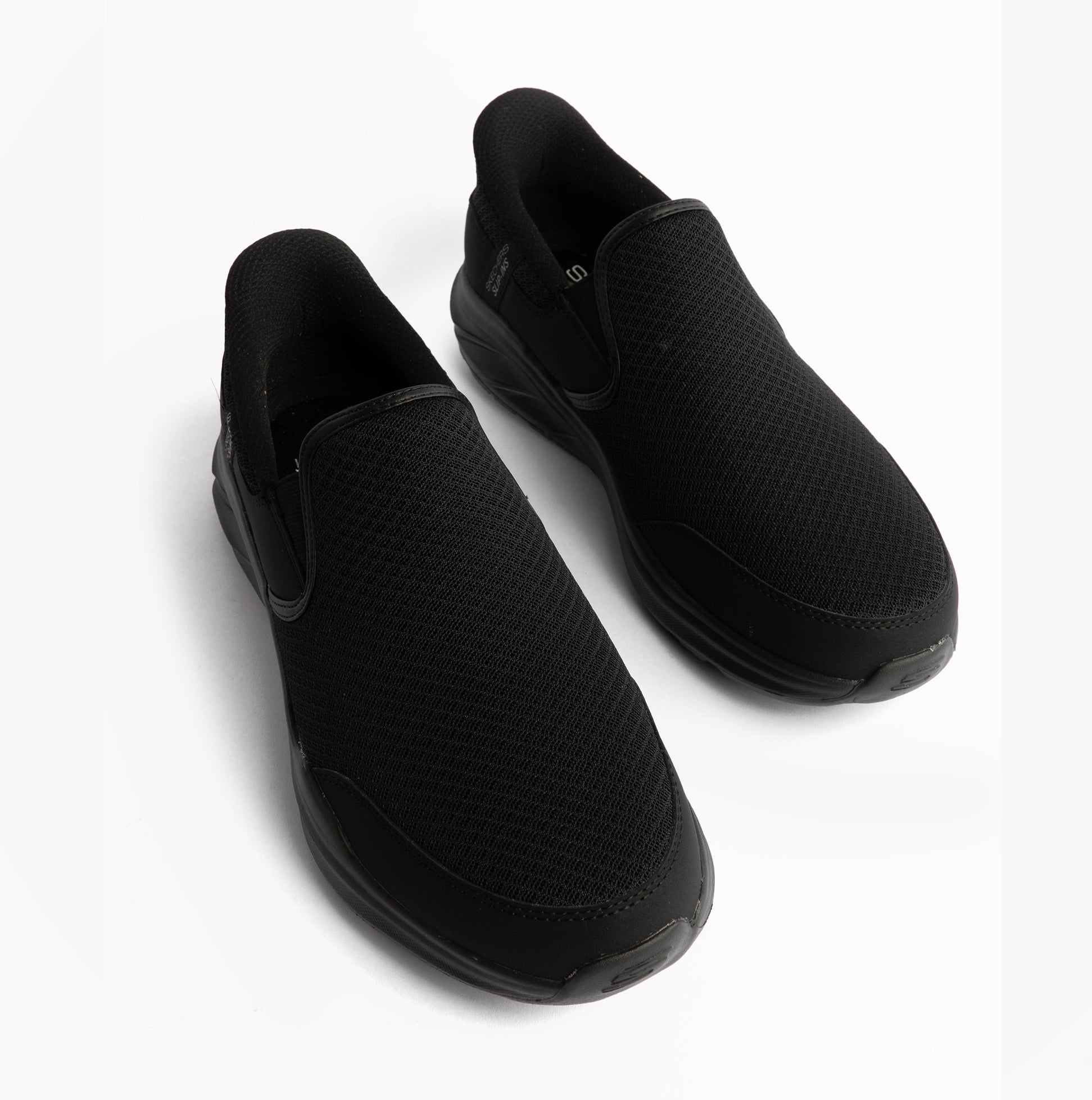 Skechers 233103/BBK EQUALIZER 6.0 - STOAVER Mens Trainers Black top view showing slip-on design and mesh upper.