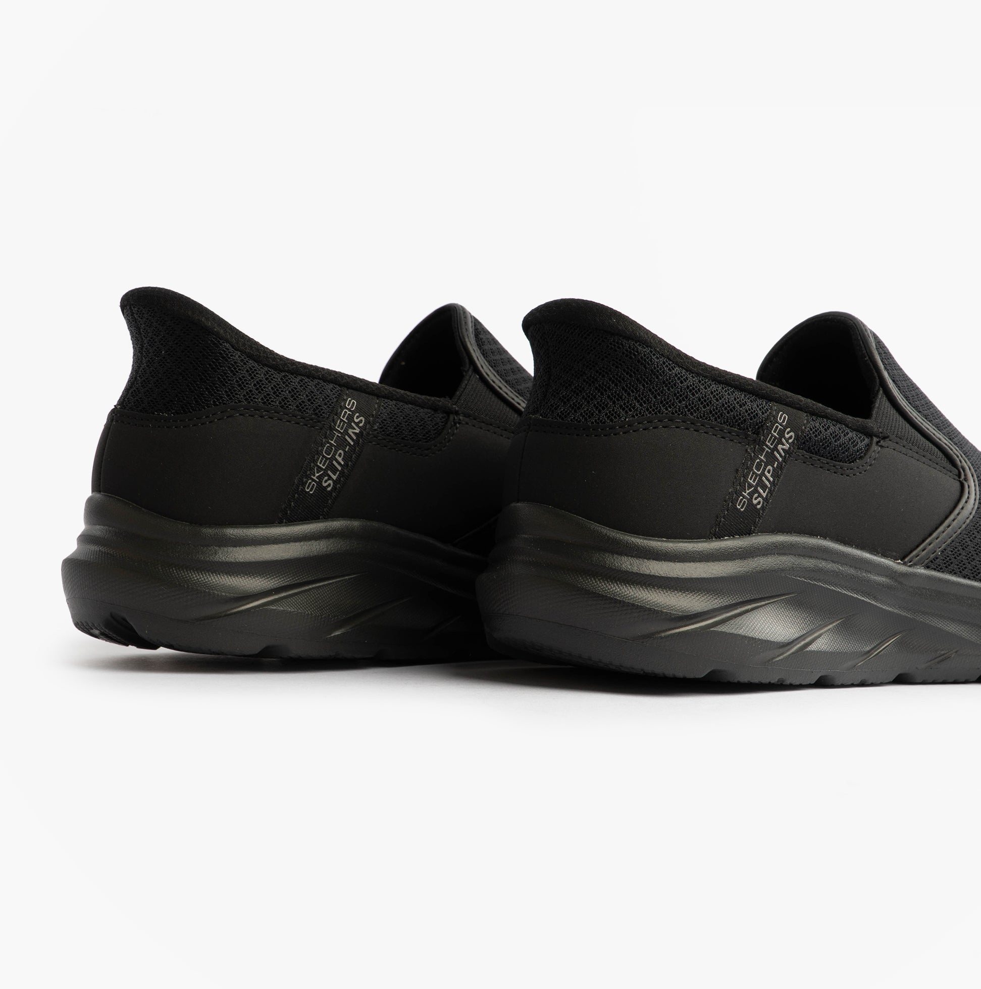 Skechers 233103/BBK EQUALIZER 6.0 - STOAVER Mens Trainers Black back view highlighting slip-on design.