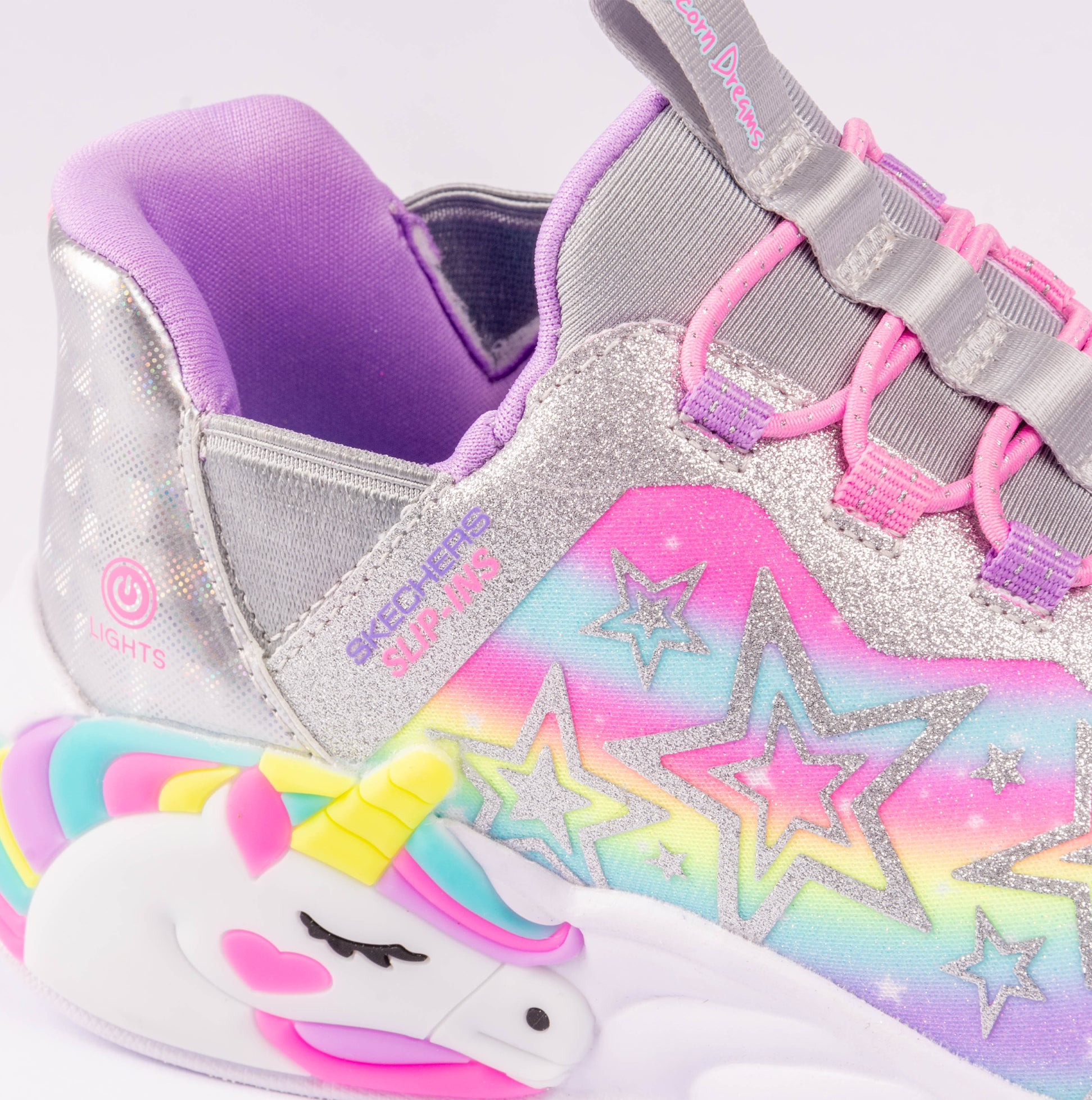 Skechers 302296L/SMLT UNICORN DREAMS - STARRY LITE Girls Trainers Silver Multi close-up view showcasing light-up features and unicorn design.