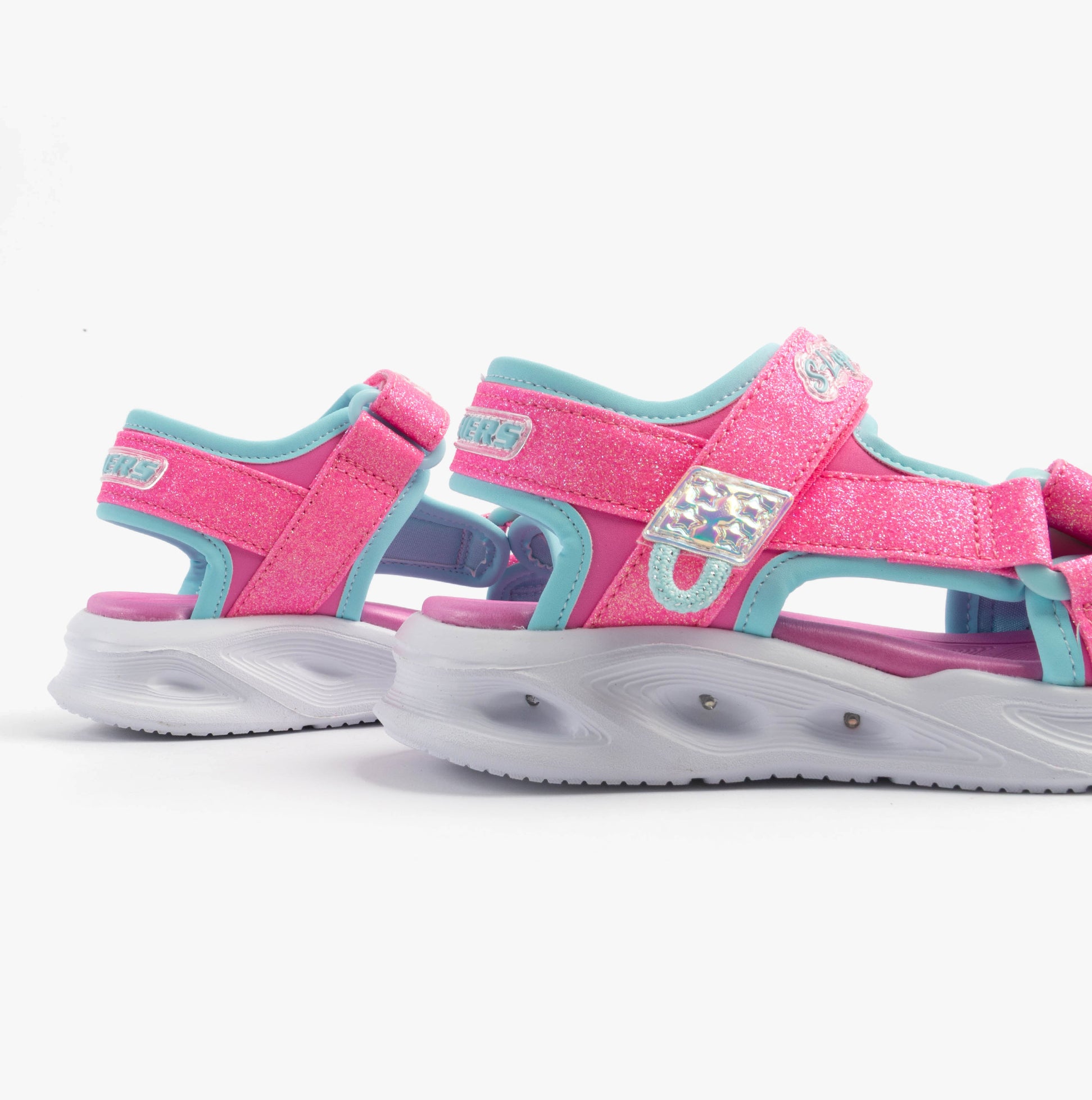 Skechers 303024L/HPAQ S-LIGHTS: SOLA GLOW Girls Sandals Hot Pink/Aqua side view showing sparkly design and comfortable fit.