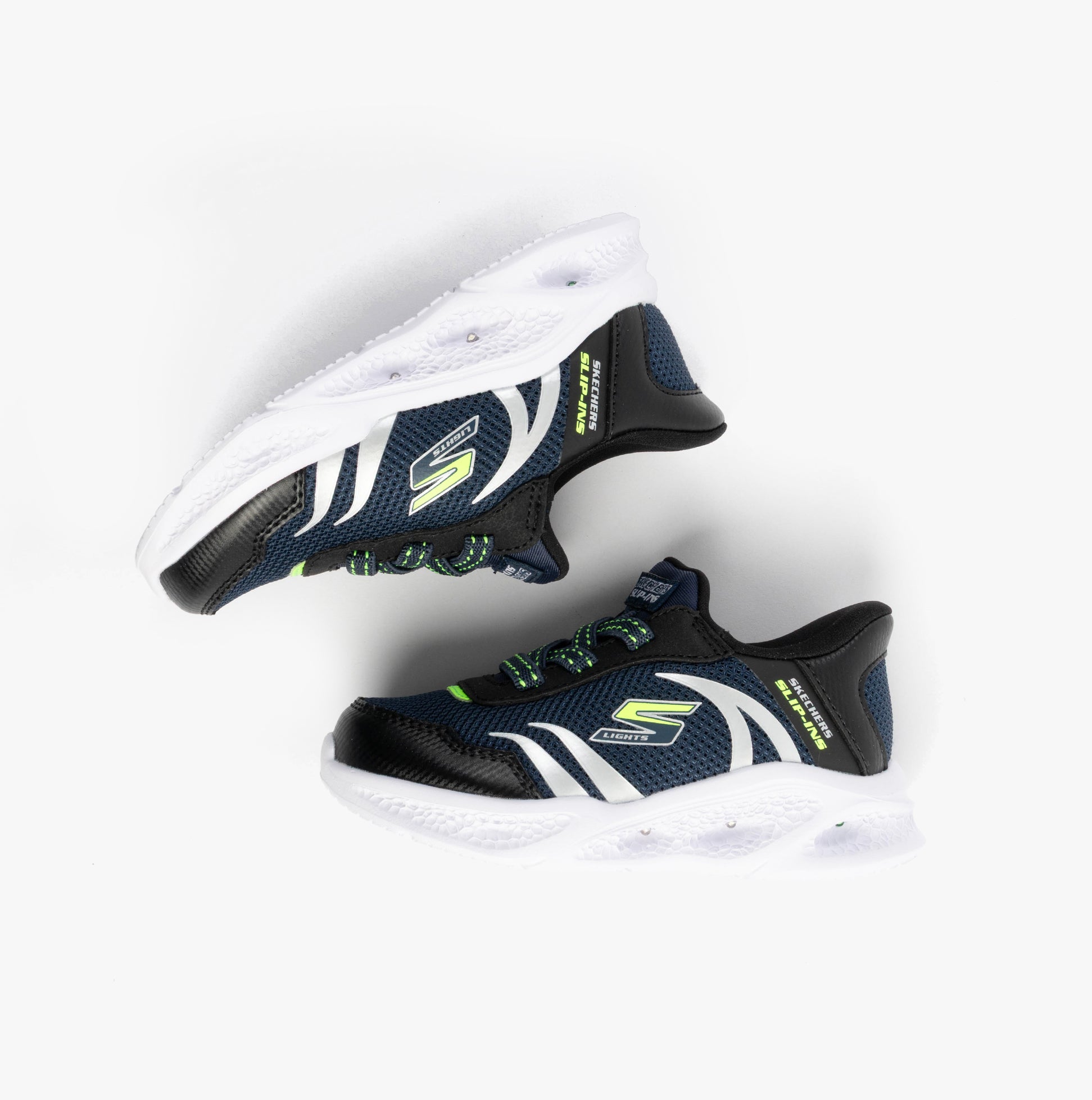 Skechers 403848N/NVBK METEOR-LIGHTS-BRISK-BEAMS Boys Trainers Navy/Black side view with white sole and neon accents.