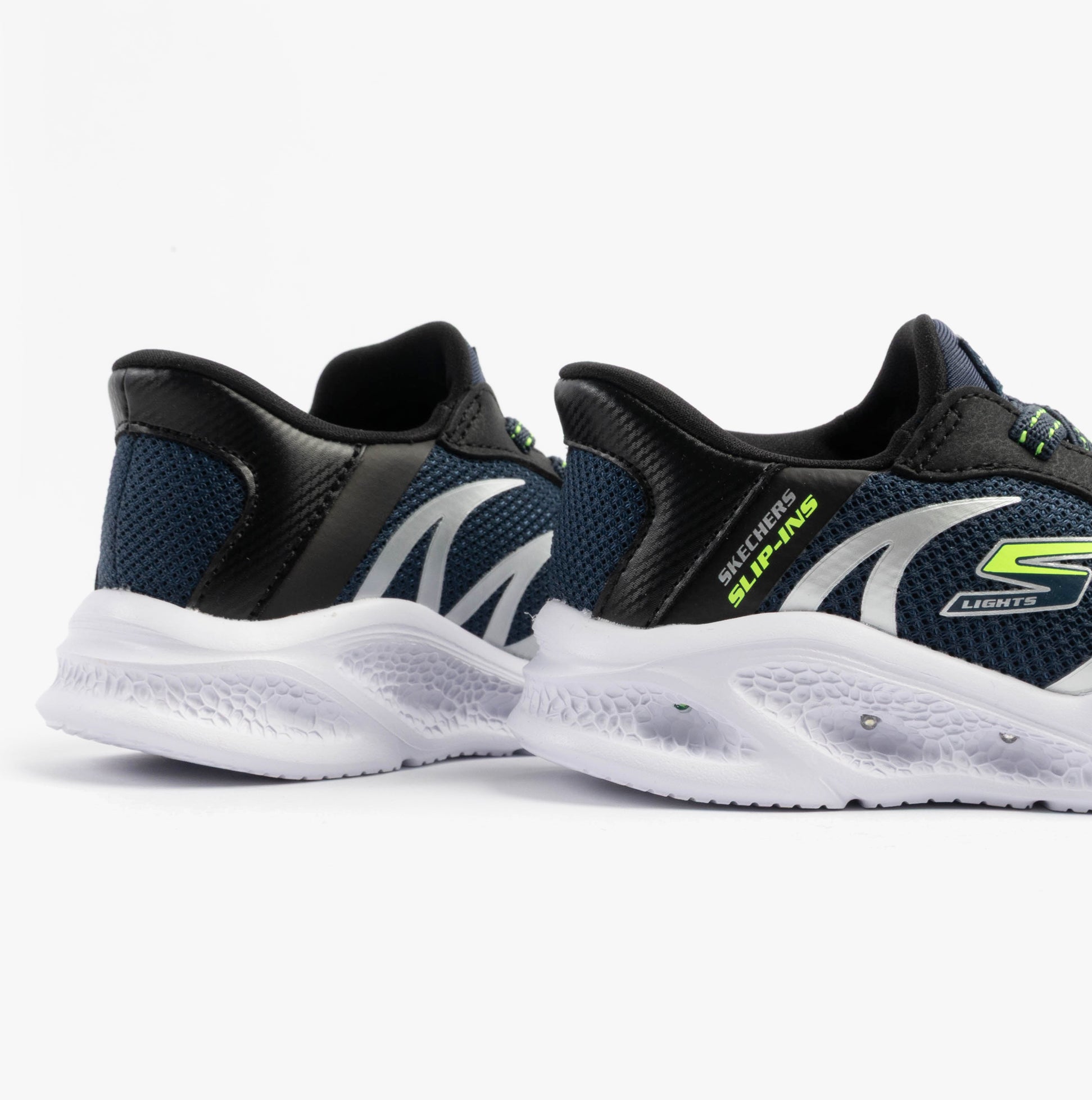 Skechers 403848N/NVBK METEOR-LIGHTS-BRISK-BEAMS Boys Trainers Navy/Black side view showing comfortable fit and stylish design.