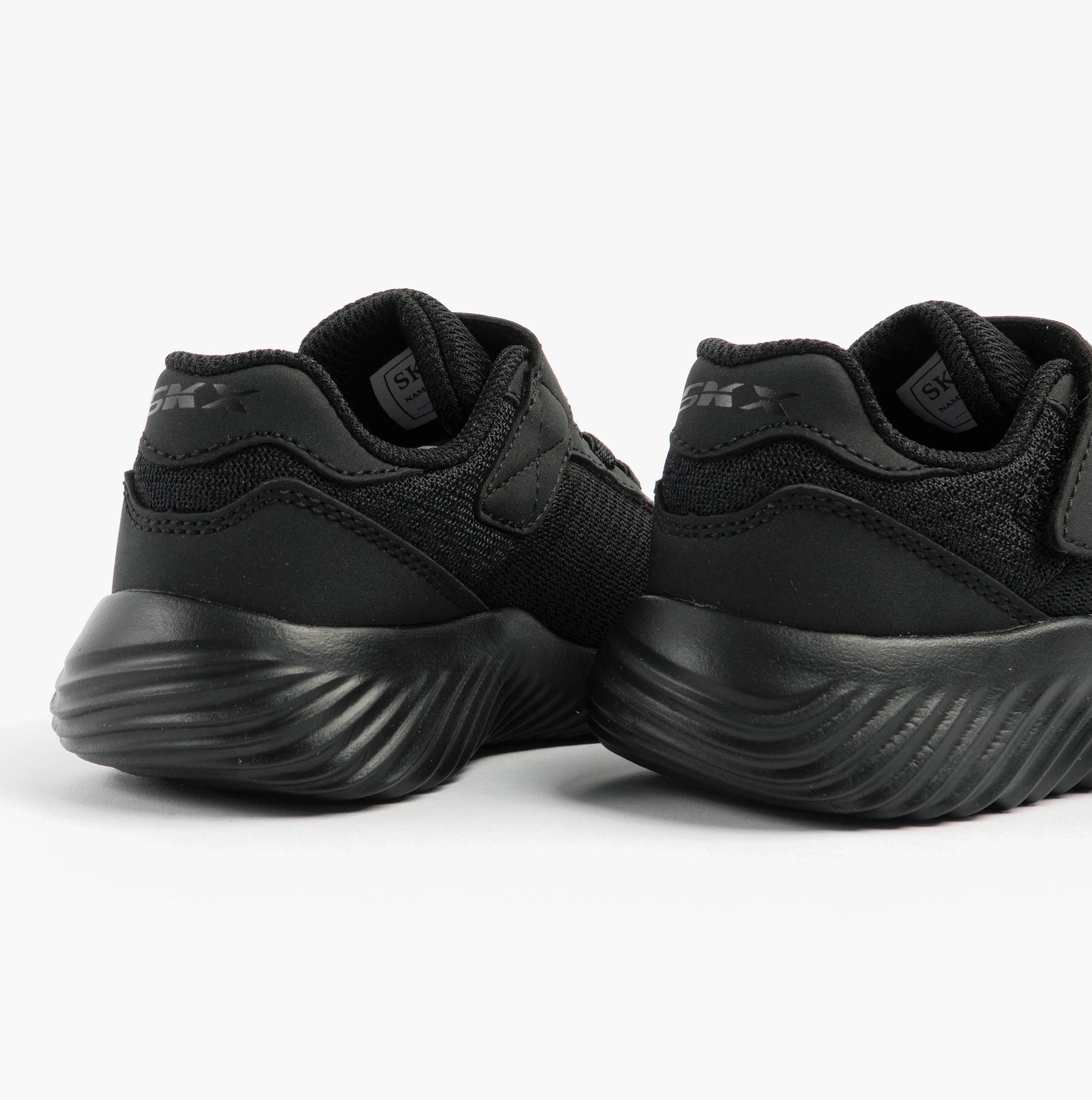 Skechers 403908N/BBK BOUNDER - TREZIC Boys Trainers Black rear view showing lightweight design and comfortable fit.