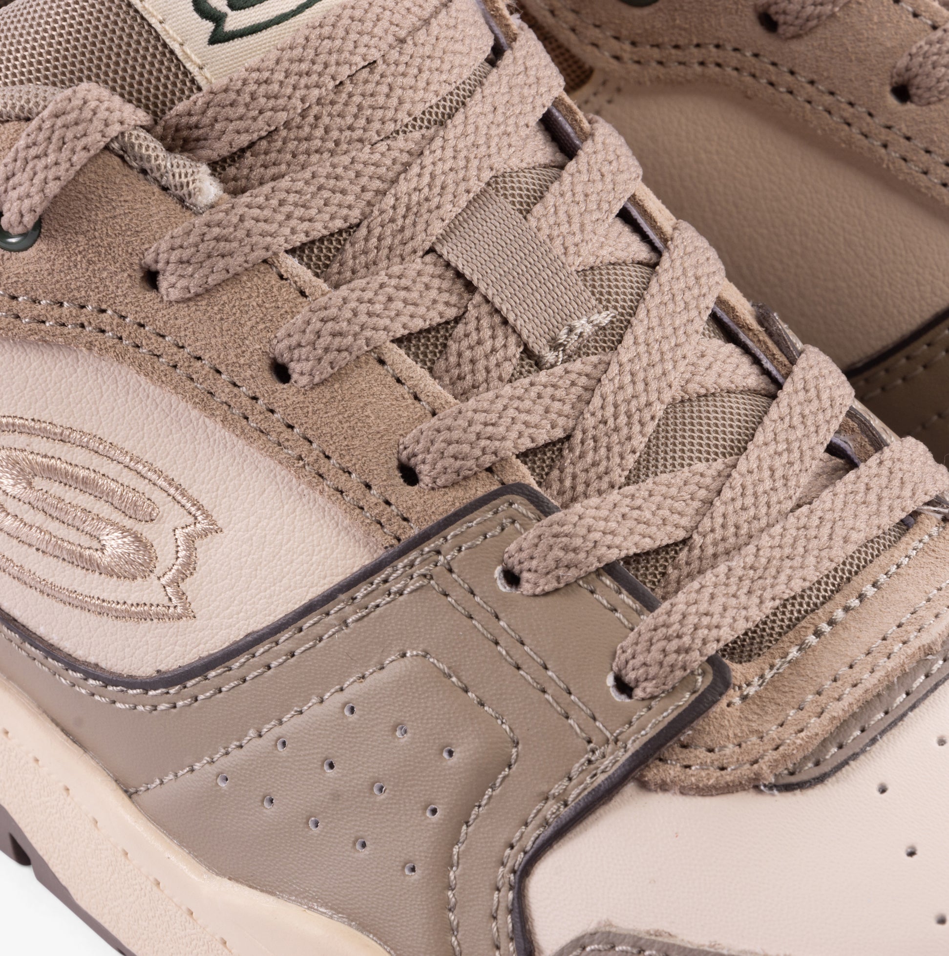 Skechers 406157L/TPE SKX-228 Boys Trainers Taupe close-up view highlighting laces and upper material details.