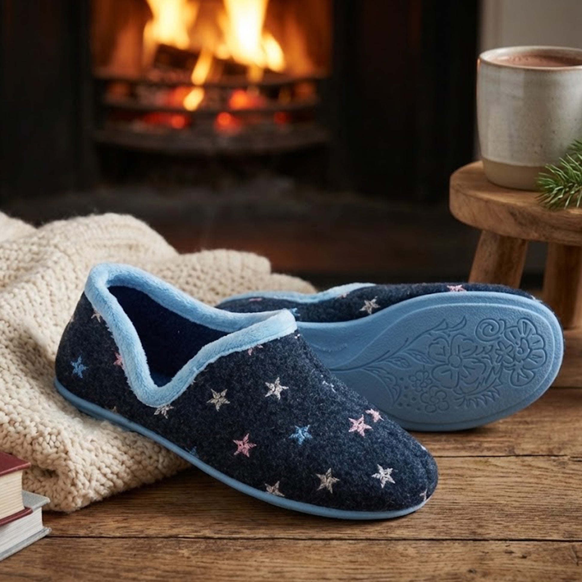 Sleepers ARIA Womens Full Slippers Slippers Navy Blue, side view showcasing embroidered design, on a cozy indoor setting.