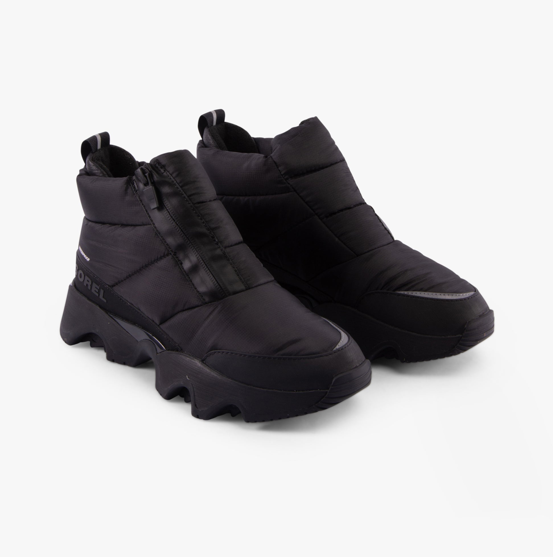 Sorel KINETIC IMPACT PUFFY ZIP Womens Winter Boots Black side view showcasing ankle height and zip closure.