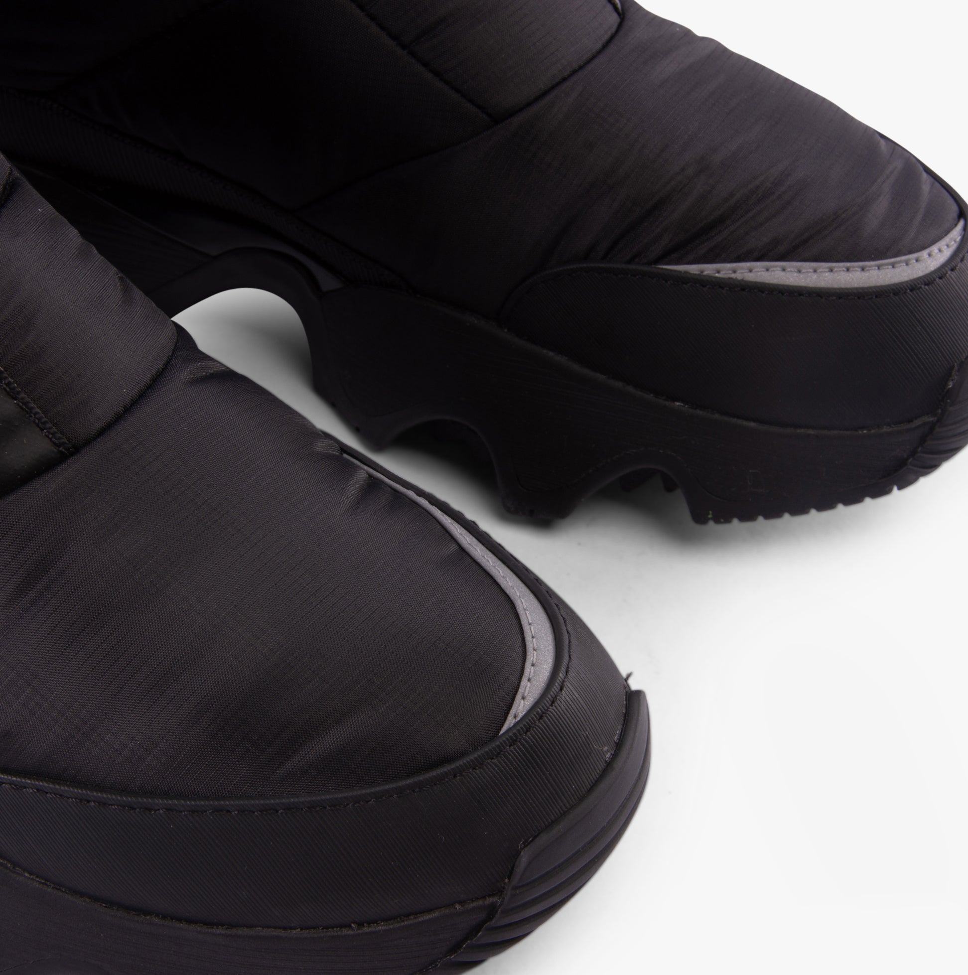Sorel KINETIC IMPACT PUFFY ZIP Womens Winter Boots Black detail view showing the upper and rounded toe design.
