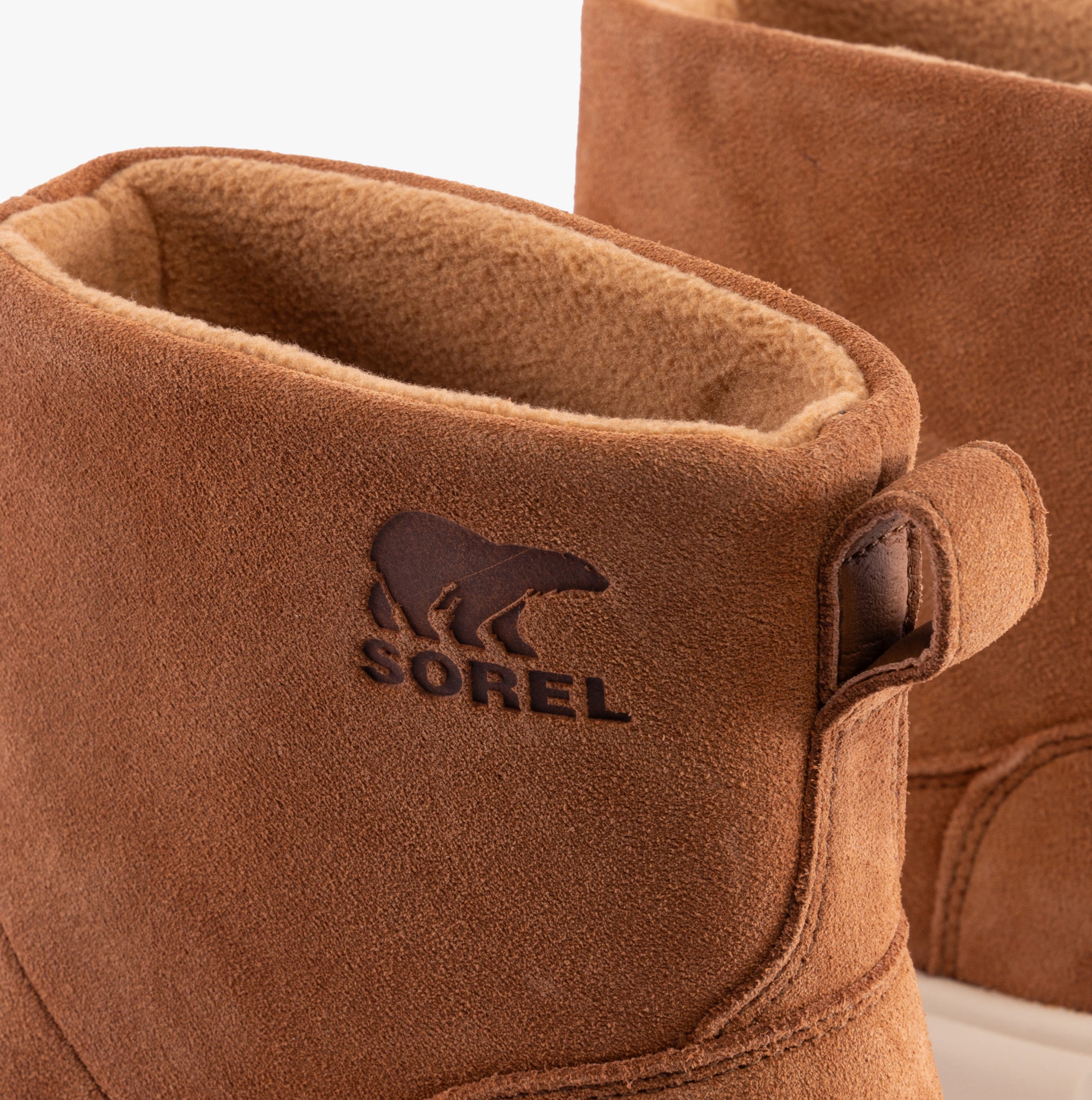 Sorel EXPLORER III SLIP-ON Womens Winter Boots Brown close-up of suede detailing and microfleece lining.