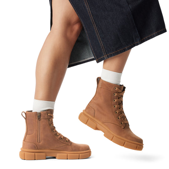 Sorel EXPLORER STRT LACE Womens Boots Brown side view on model, showcasing ankle height and lace-up design.