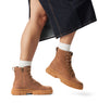 Sorel EXPLORER STRT LACE Womens Boots Brown side view on model, showcasing ankle height and lace-up design.