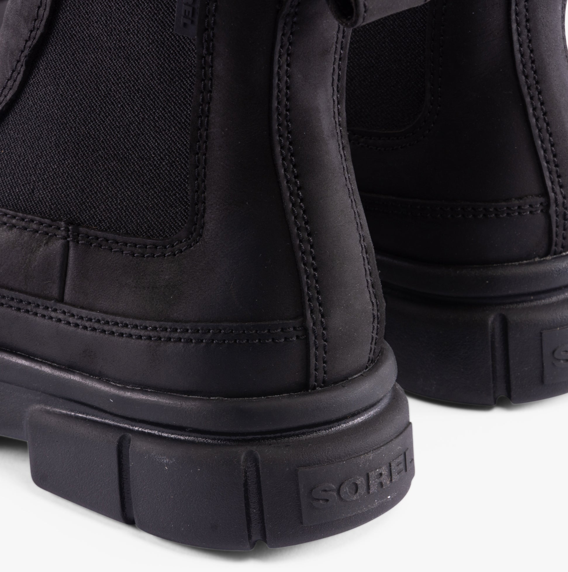 Sorel EXPLORER STRT Womens Chelsea Boots Black back view showing leather and textile details.