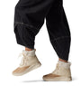 Sorel OUT N ABOUT IV CHILLZ Womens Winter Boots Brown side view on model in relaxed pants