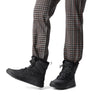 Sorel WHITNEY II PLUS LACE Womens Winter Boots Black side view worn with stylish pants.