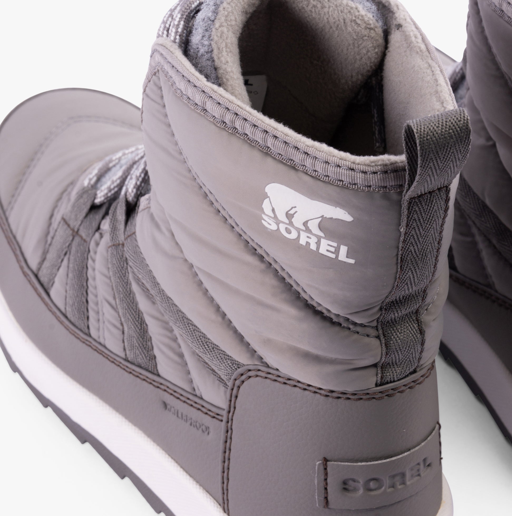 Sorel WHITNEY II PLUS LACE Womens Winter Boots Grey side view showcasing ankle height and lace-up design.