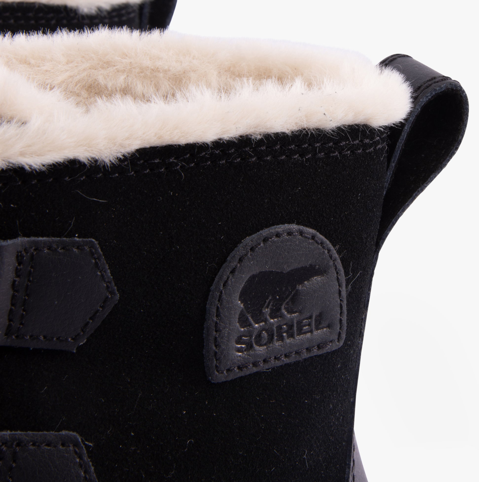 Detail view of Sorel TORINO V Womens Winter Boots Black showcasing soft microfleece lining and logo.