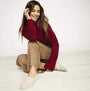 TOMS ALPARGATA Womens Canvas Espadrille Natural sitting view with model, wearing relaxed fit outfit and showcasing the espadrille style.