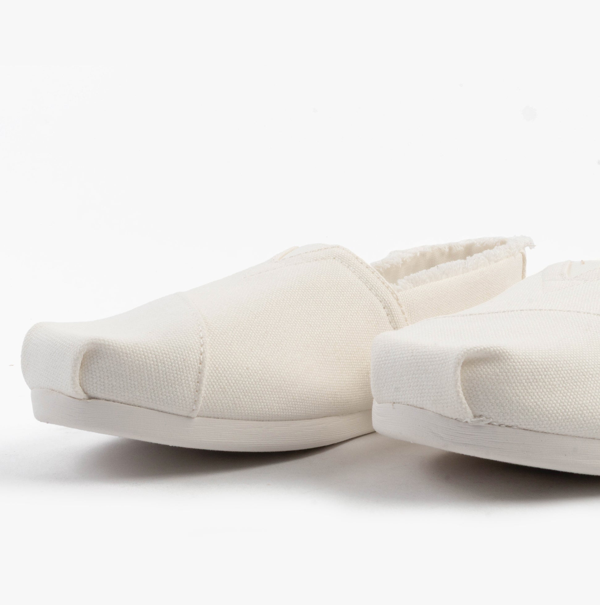 TOMS ALPARGATA CLASSIC Womens Espadrille White side view showcasing lightweight textile upper and round toe design.
