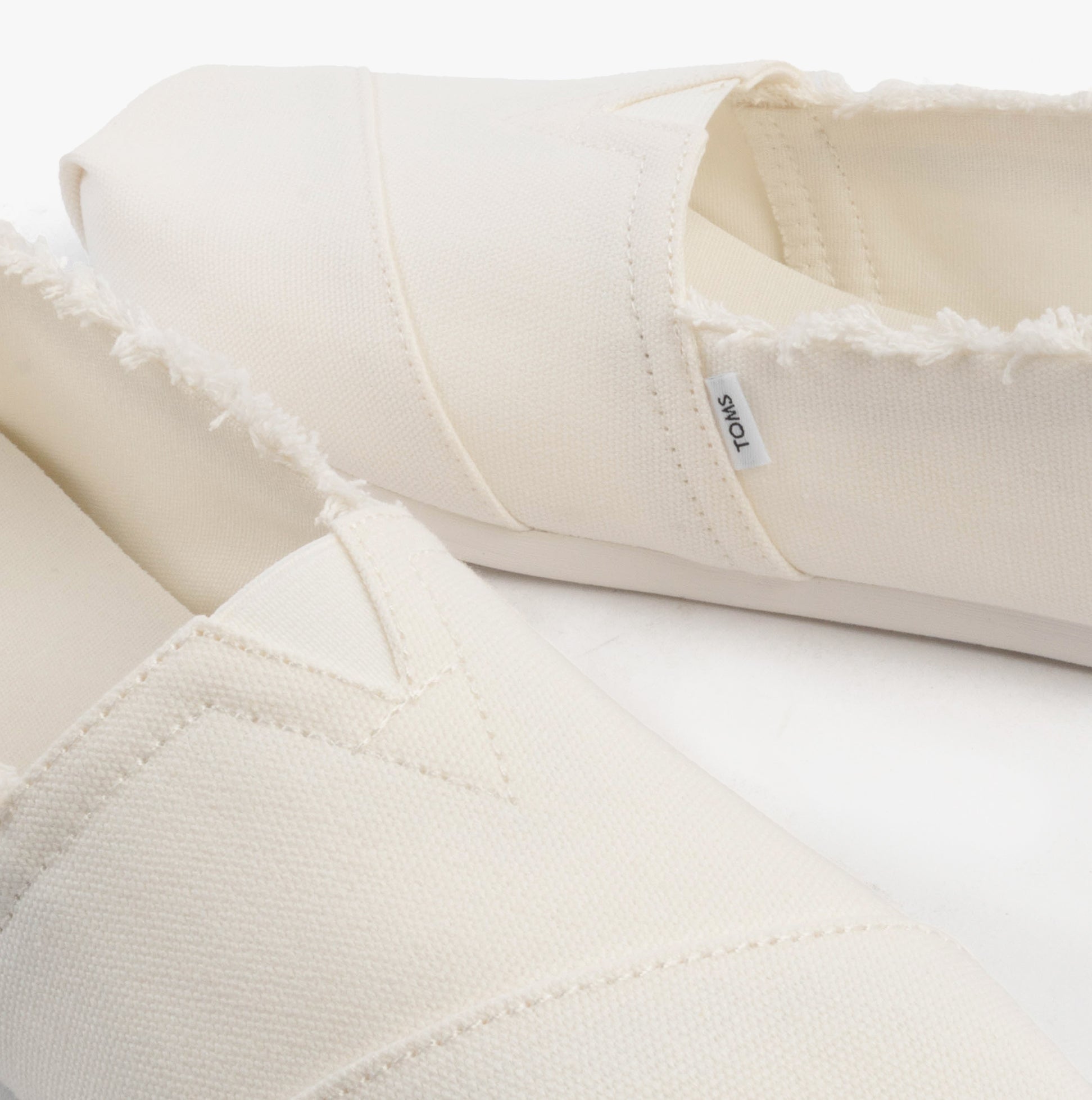 TOMS ALPARGATA CLASSIC Womens Espadrille White detail view showing soft textile upper and slip-on design.