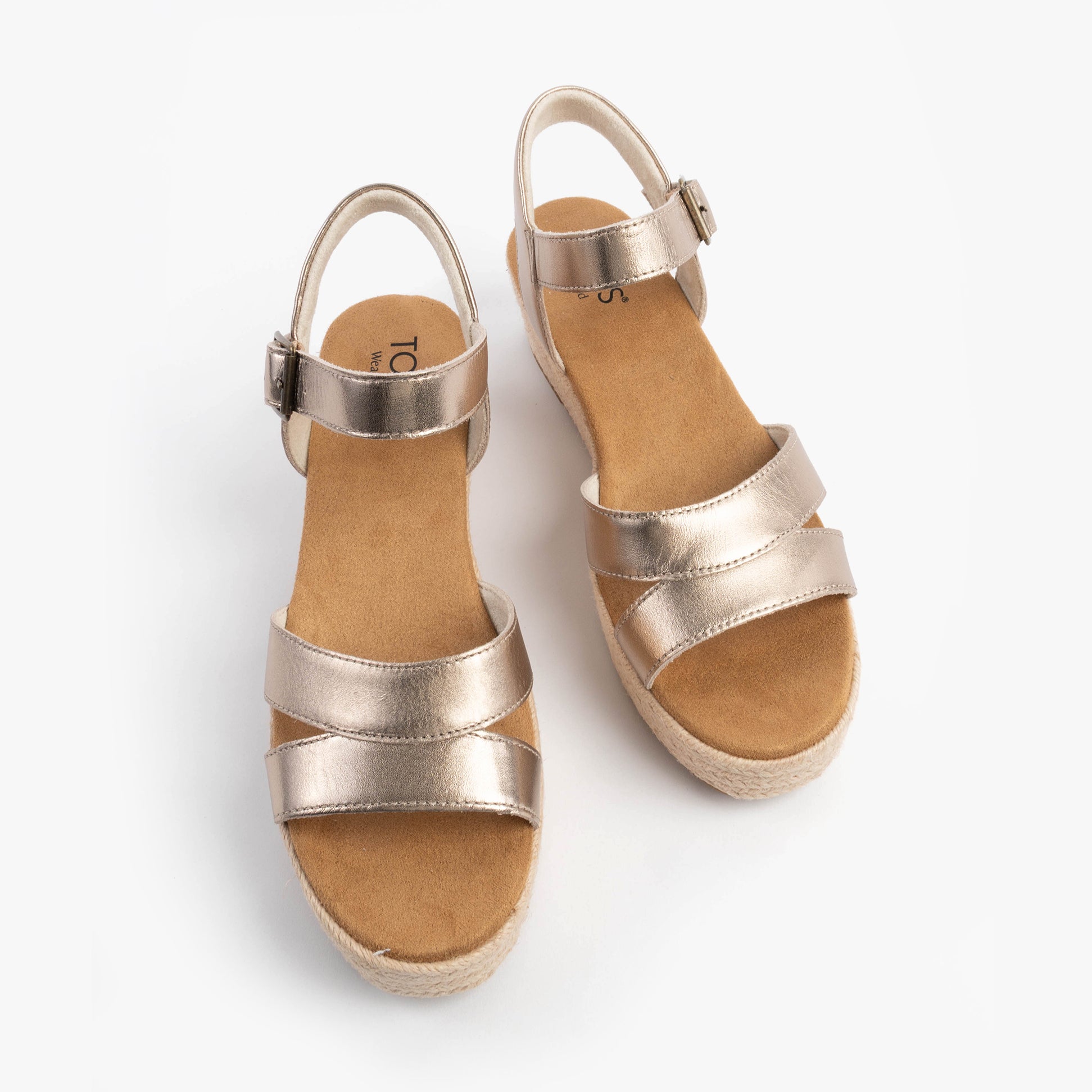 TOMS AUDREY Womens Sandals Gold top view showcasing the elegant wedge design and comfortable straps in a stylish metallic finish.