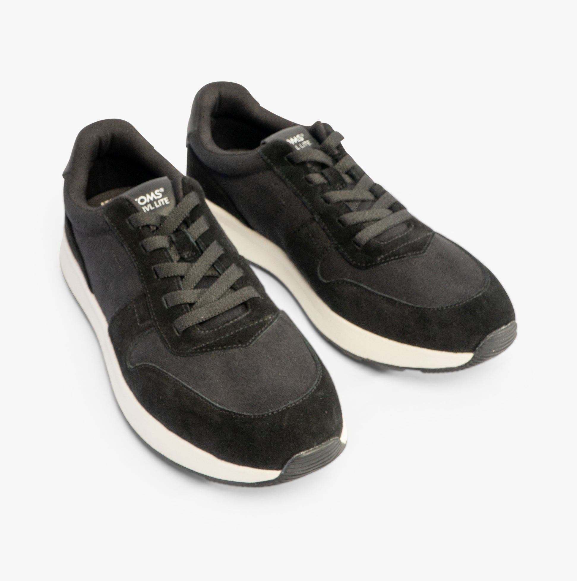 TOMS TRVL LITE RETRO Mens Trainers Black top view showing lace-up design and suede upper.