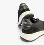 TOMS TRVL LITE RETRO Mens Trainers Black rear view showcasing suede upper and lace-up design.