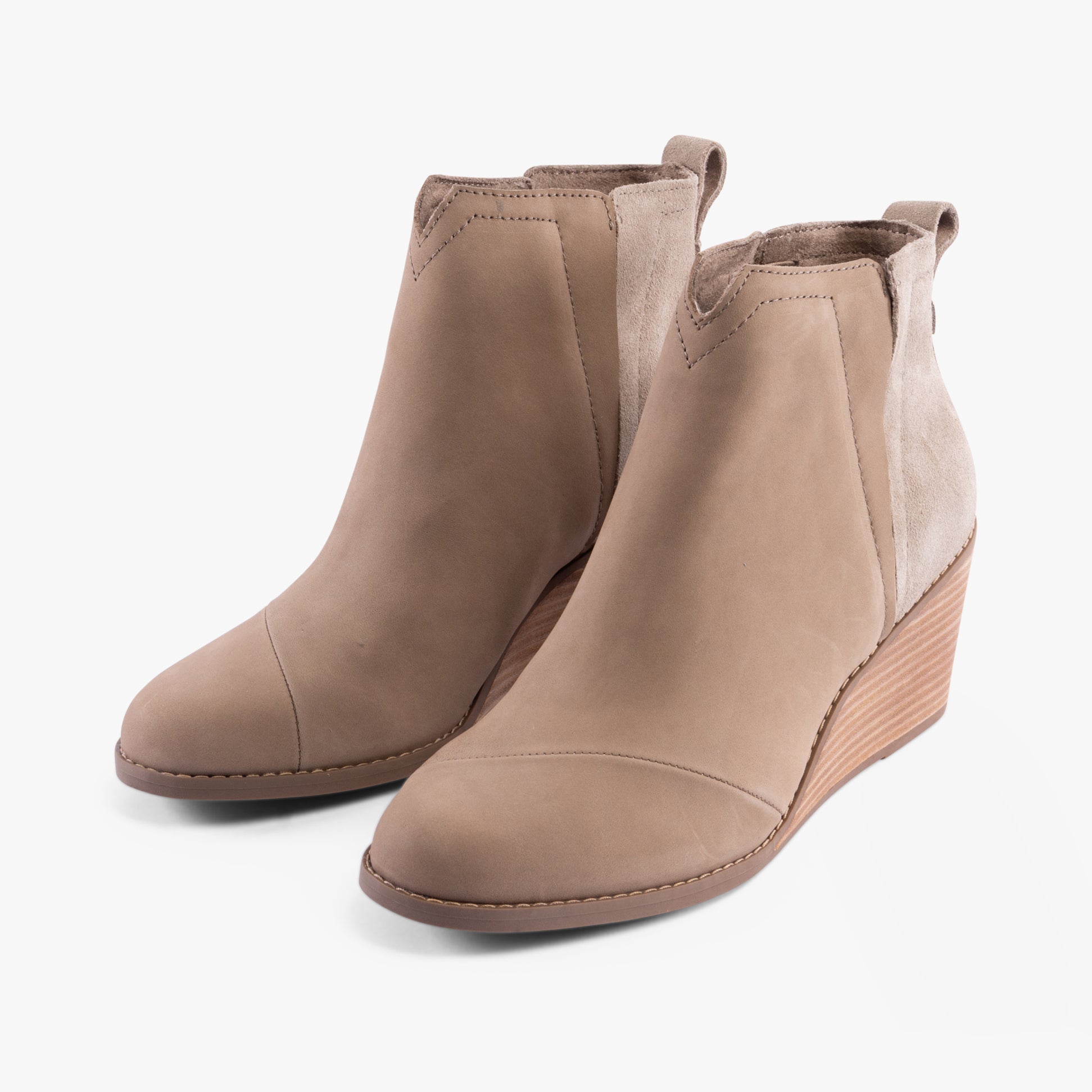 TOMS CLARE Womens Boots Natural side view showing leather suede ankle boots with wedge heel in beige color.