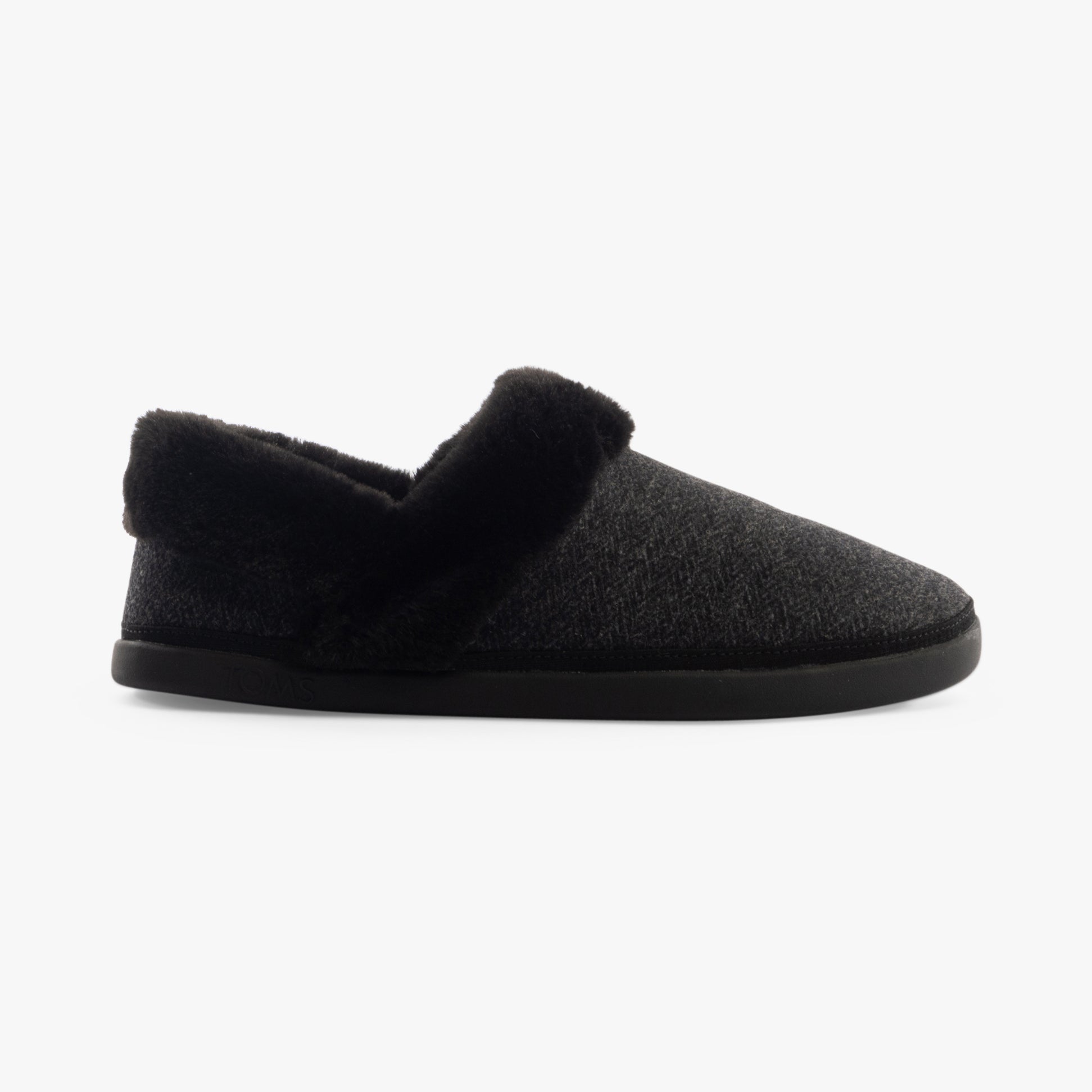 TOMS OSLO Womens Slippers Black side view featuring soft textile upper and relaxed fit.