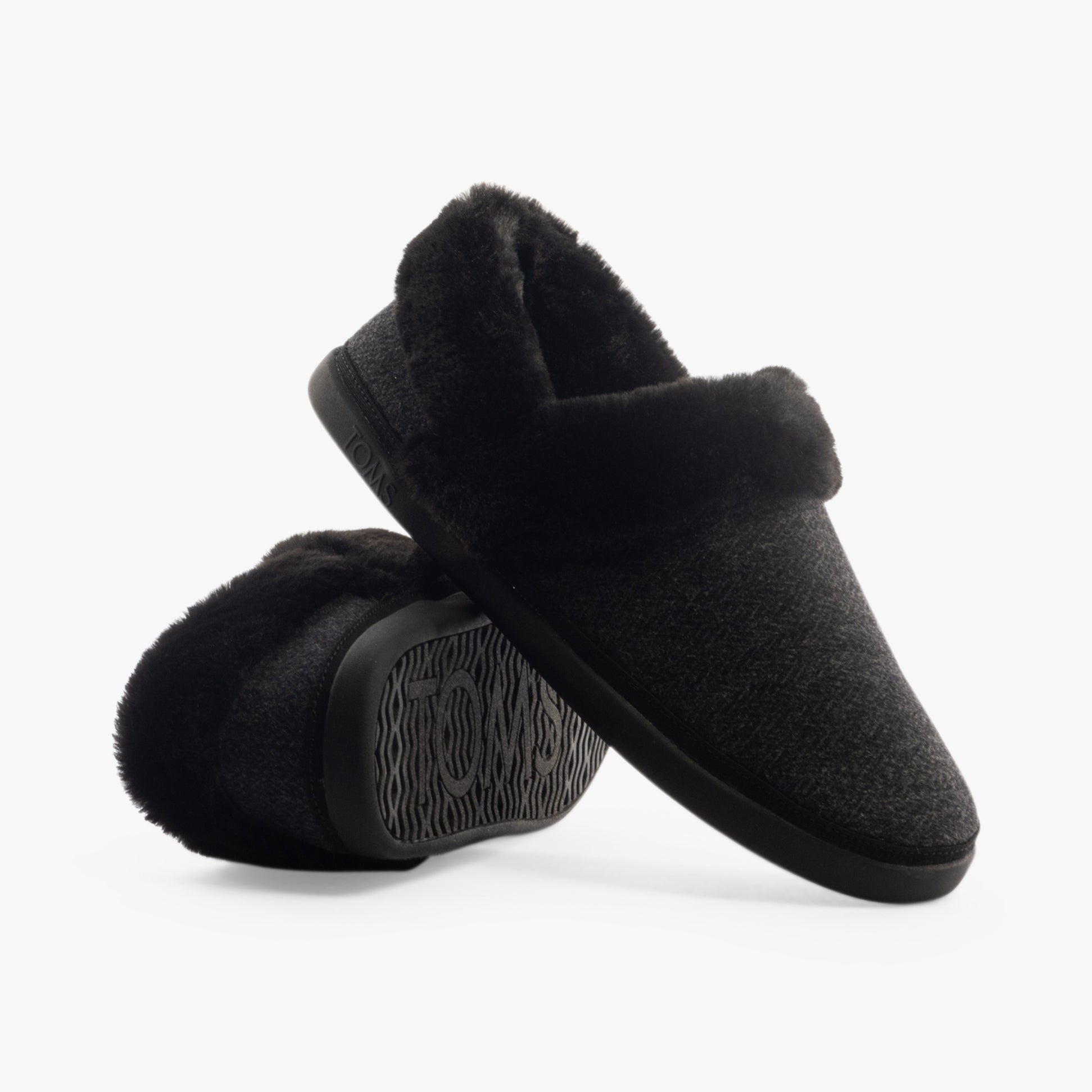 TOMS OSLO Womens Slippers Black side view showing the soft textile upper and round toe design.