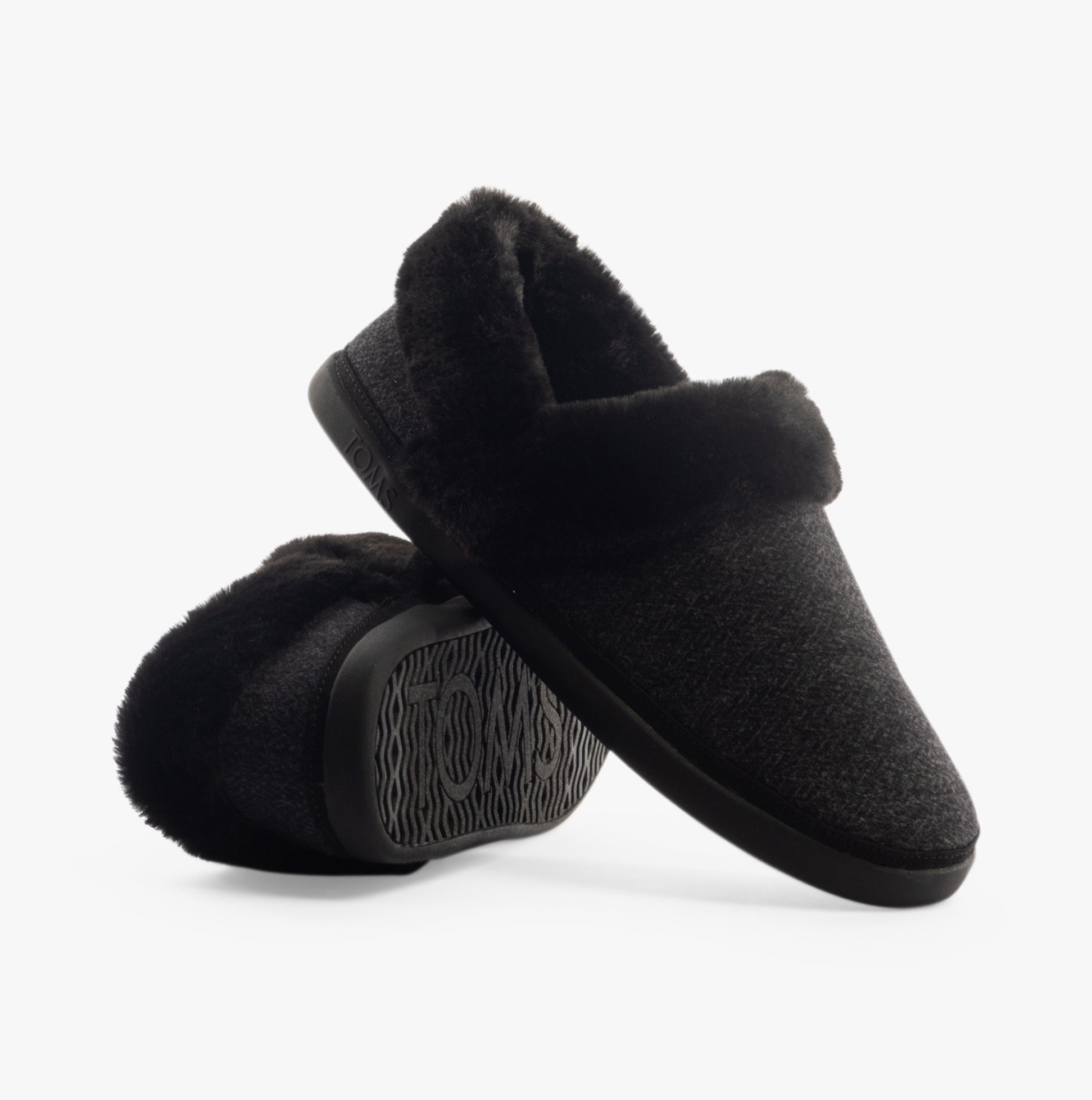 TOMS OSLO Womens Slippers Black side view showing the soft textile upper and round toe design.