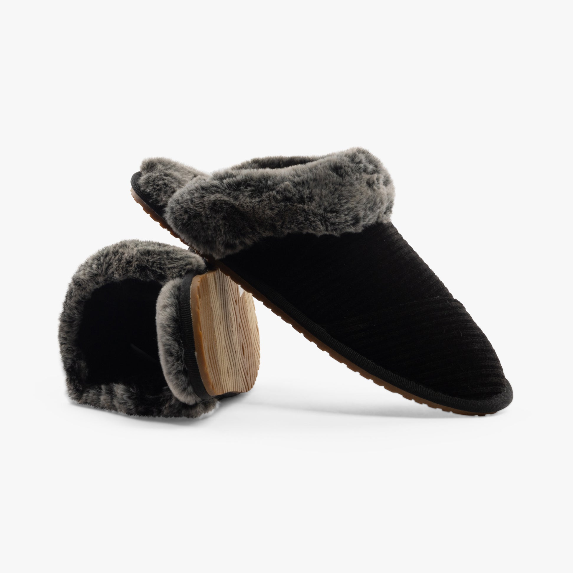 TOMS VALERIE Womens Slippers Black side view showing soft textile upper, round toe, and plush lining.
